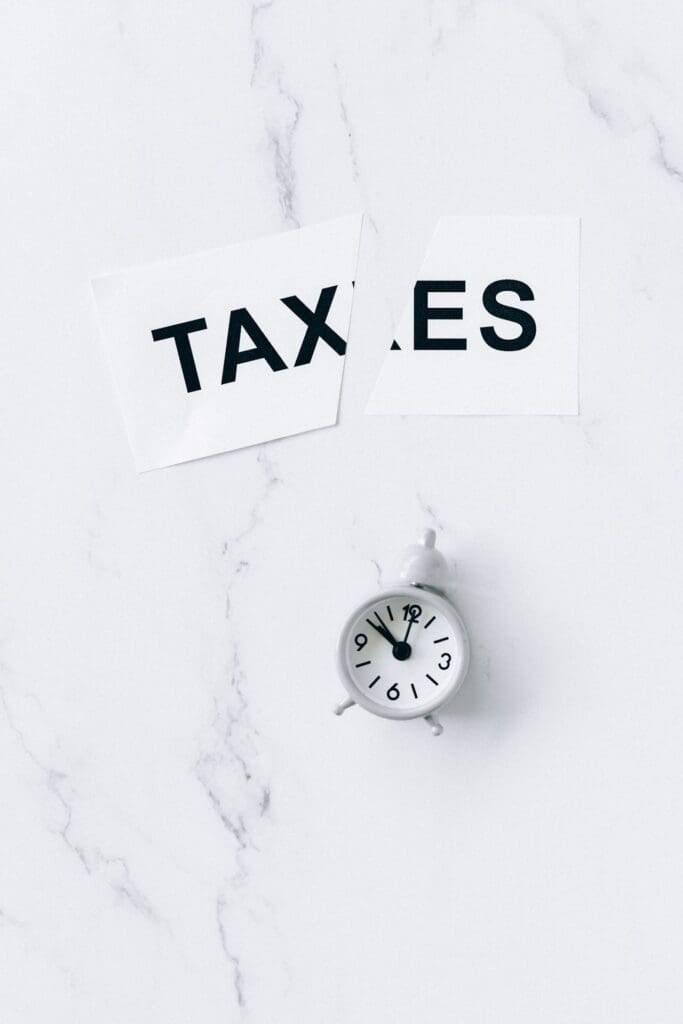 Tax papers and clock showing accounting reno nv support for timely tax preparation and payroll planning